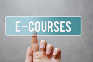 E-courses - finger pressing blue transparent button on virtual touchscreen interface on gray background with copy space for text. E-school and online education concept. 