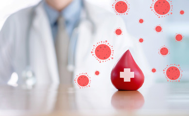 Doctor hands protracted a red blood for anti covid-19