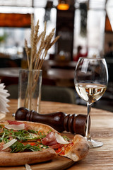 pizza with jamon and herbs