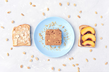 Delicious toast with peanut butter, nectarine and almonds.