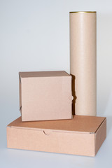piles of three cardboard boxes on grey white background