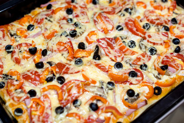Delicious pizza with cheese and olives. Toned style photo. Pizza texture.