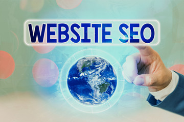 Writing note showing Website Seo. Business concept for tactics used to increase the amount of...