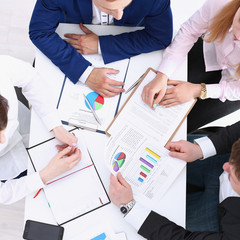 Group of people in suits crossed hands in pile for win closeup. White collar leadership, high five, cooperation initiative achievement, corporate life style, friendship deal, heap, stack concept