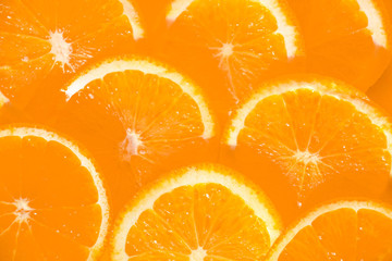 slices of orange on a black background