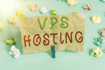 Text sign showing Vps Hosting. Business photo text mimics a dedicated server within a shared hosting environment Colored crumpled papers empty reminder blue floor background clothespin