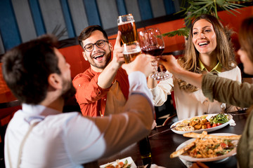 Young people having dinner in the restaurant
