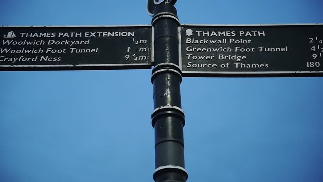 A Metal Sign Post Conveying The Directions Of Thames Path Extension And Thames Path Located In Southeast London. -medium shot
