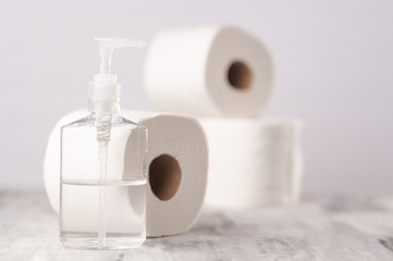 Sanitizer disinfector on the table, light background. Fighting the virus and coronavirus