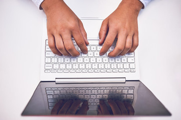 Fototapeta na wymiar Man hand on laptop keyboard with blank screen monitor