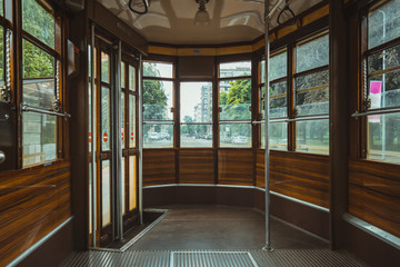 Empty old fashioned tram interior in Milan, Italy