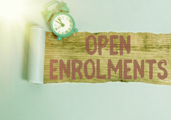 Conceptual hand writing showing Open Enrolments. Concept meaning when employees may make changes to...