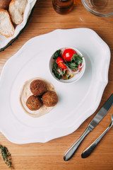 Meat cutlets with garnish on a plate. Cutlets with buckwheat and sauce.