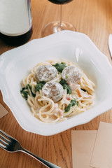 Pasta with cutlets and tomato sauce. Macaroni with meat and spices in the restaurant.