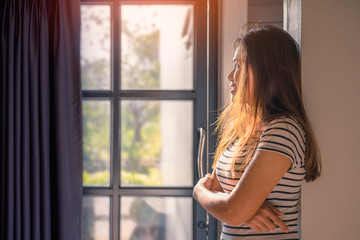 Asian woman quarantine herself at home. After the Coronavirus or Covid-19.