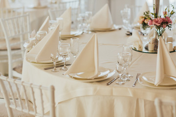 Tables set for an event party or wedding reception. Luxury elegant table setting dinner in a...