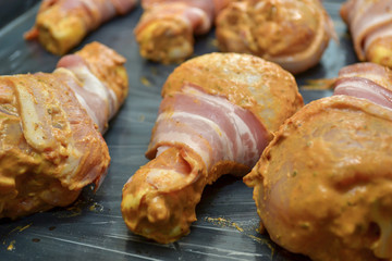 chicken legs wrapped in bacon