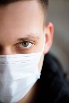 Portrait Of A Young Guy In A Protective Face Mask.  New Coronavirus (2019-nKoV) Infection