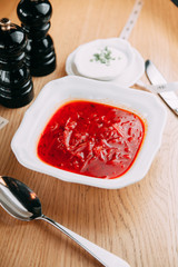 Serving dishes with mashed soup in the restaurant. Vegetable soup in a white plate.
