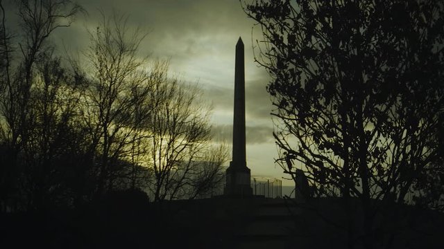 Reveal of the Tandle Hills war memorial under a golden sunset. Anamorphic ratio footage.

