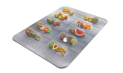 Natural vitamins in tablets. Fresh fruit in a blister instead of pills. Аlternative medicine. Multivitamins and dietary supplements for a healthy diet. Creative concept. 3D render illustration.