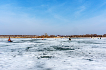 fishermen on the winter lake, winter sports winter fishing