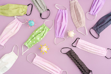 Colorful DIY corona covid19 fabric face mask on pink background