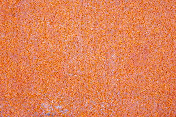 old red paint rust. Rusted painted metal wall. Old Rusty background with streaks of rust. Rust stain.