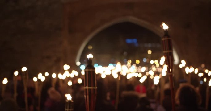 Torchlight procession at night people walk and protest with burning torches