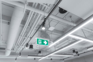 Large white pipes inside the building. modern electric system and air system in the building.