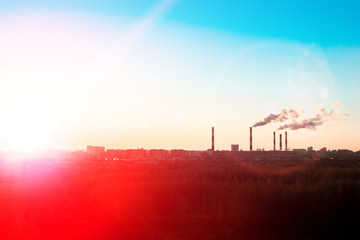 concept of environmental pollution by factories. the plants on the background of sunset sky. selective focus