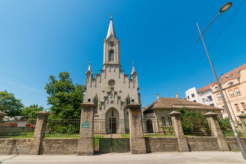 Fototapeta na wymiar Novi Sad, Serbia - August 06, 2019: Reformed Christian Church in Novi Sad, Serbia. This religious building is also called Reformist-Calvinist church. Today’s building was built in 1865.
