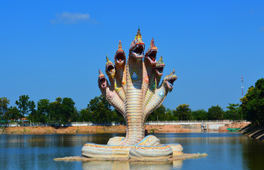 Seven head serpent sculpture in a pond
