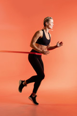 Fototapeta na wymiar Side view woman running. Home workout.