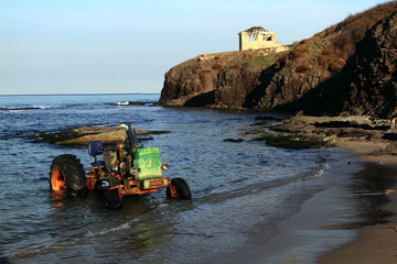old tractor on the beach