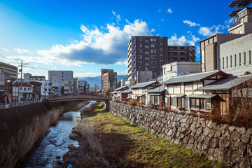 Fototapeta na wymiar Yudanaka, Japan - January 05, 2020: View to the mount River in the Small Station City near Nagano