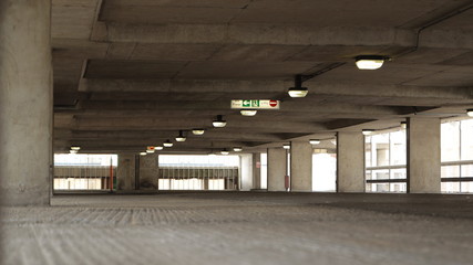 Parking Garage - Empty parking garage with signage