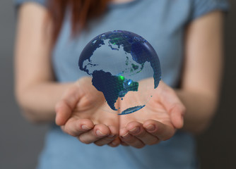 Human Hand Holding The World In Hands.