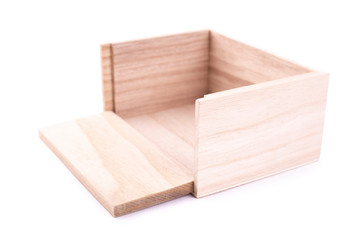 Wooden box with hinged wall on a white background