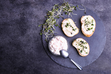Toasts with cream and radish microgreen