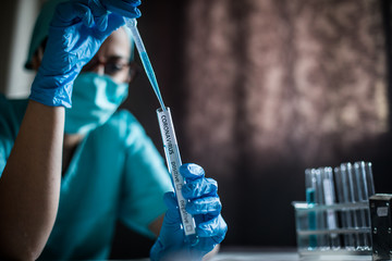 Doctor taking samples from coronavirus COVID-19 test tube