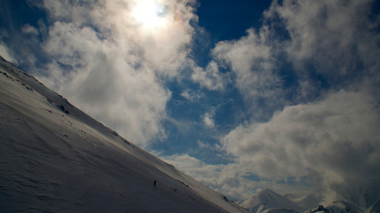 Fototapeta na wymiar Erzurum Palandoken (Palandöken) mountains and cloudy sky. Palandoken ski resort. Snowy mountain ranges.