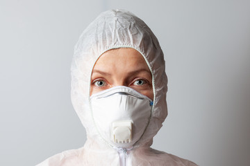 Woman in mask and protective suit, close-up.