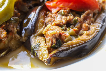 Cauliflower - baked vegetables with eggplant, ground meat and tomato sauce in the oven, Turkish cuisine, horizontal view from above, close-up