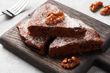 Fototapeta na wymiar Homemade chocolate brownie with walnuts. Baking chocolate cake. copy space