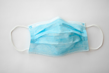 protective medical mask. isolated on gray background. Pandemic COVID-19