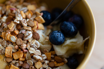 Breakfast bowl. Yogurt, cereals, berries and banana