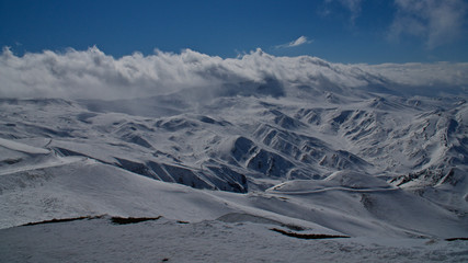 Erzurum Palandoken (Paland&ouml;ken) mountains and cloudy sky. Palandoken ski resort. Snowy mountain ranges.