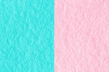 Abstract pink and blue color felt fabric textured background with copy space for design and decoration. Two tone background fashionable glamorous divided into two parts.