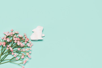 Creative easter composition with decorative  bunny and flowers